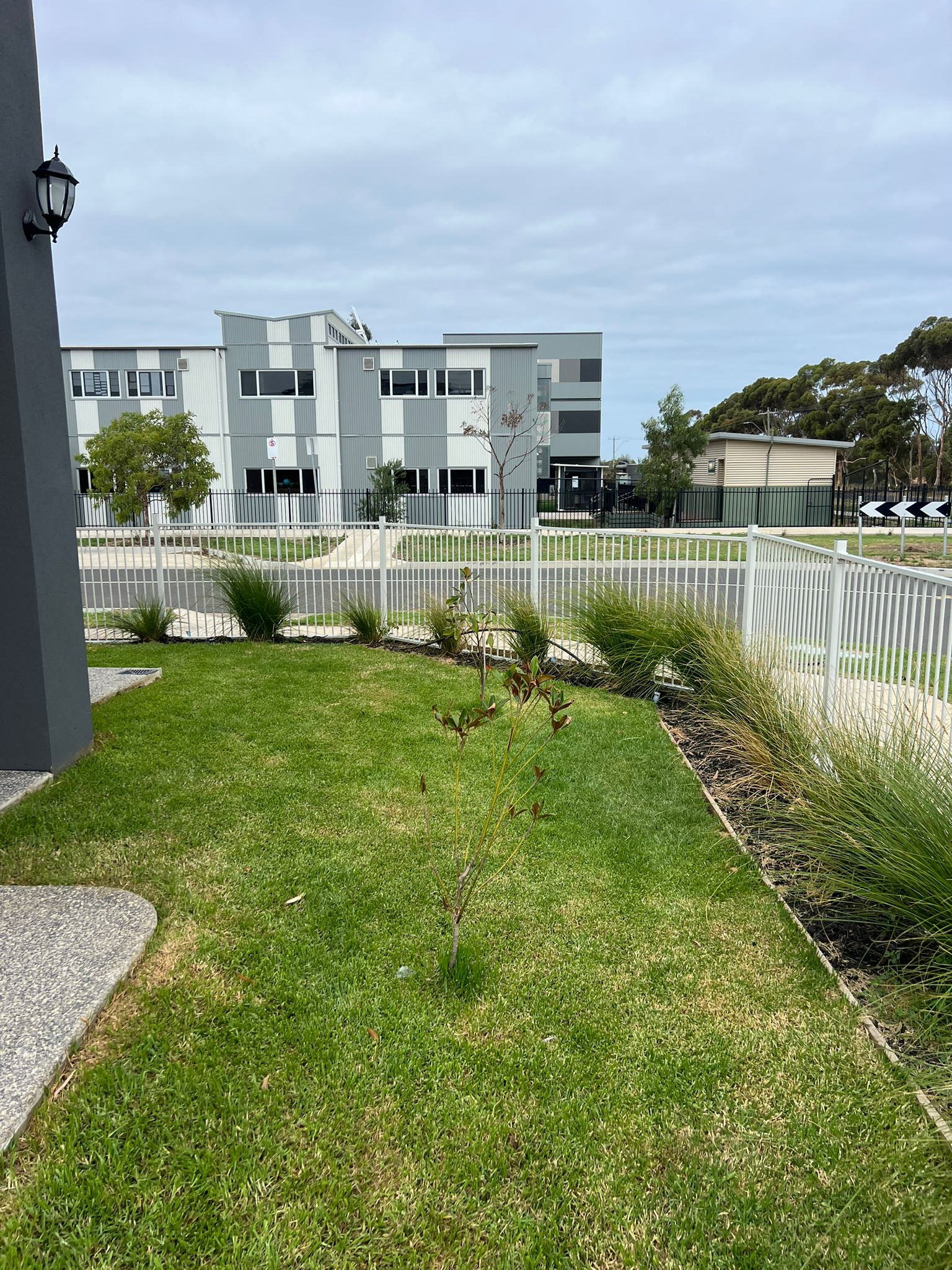 White tubular aluminium pool fence in a new estate, Werribee