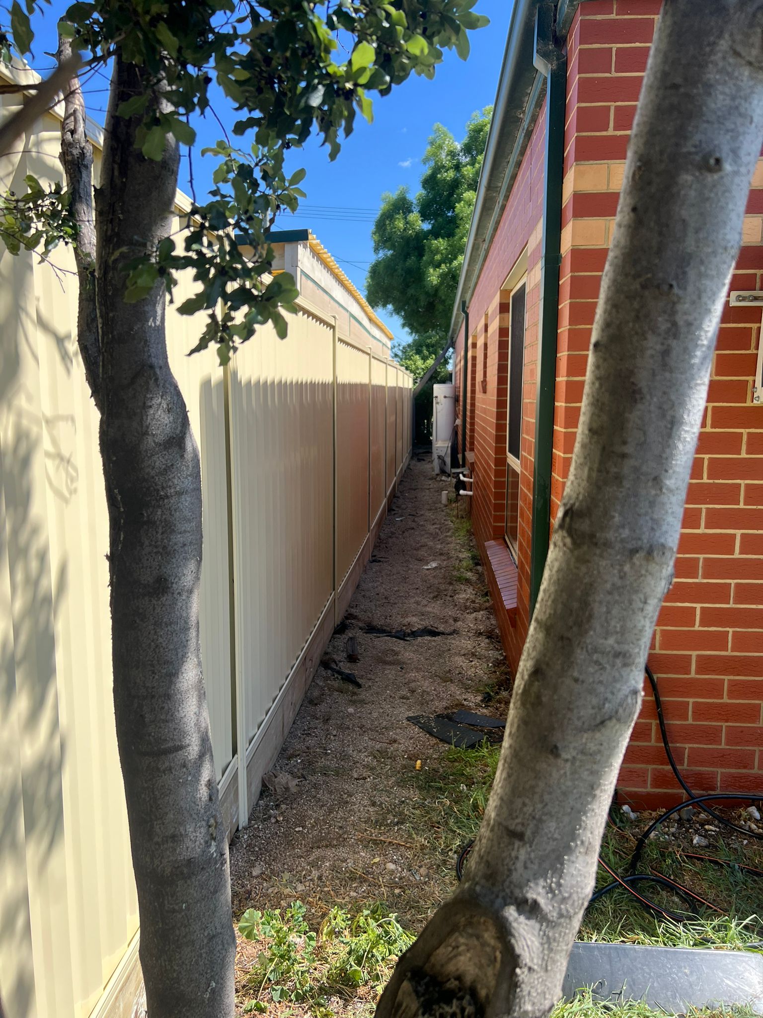 Long-run boundary Colorbond fence, Eynesbury
