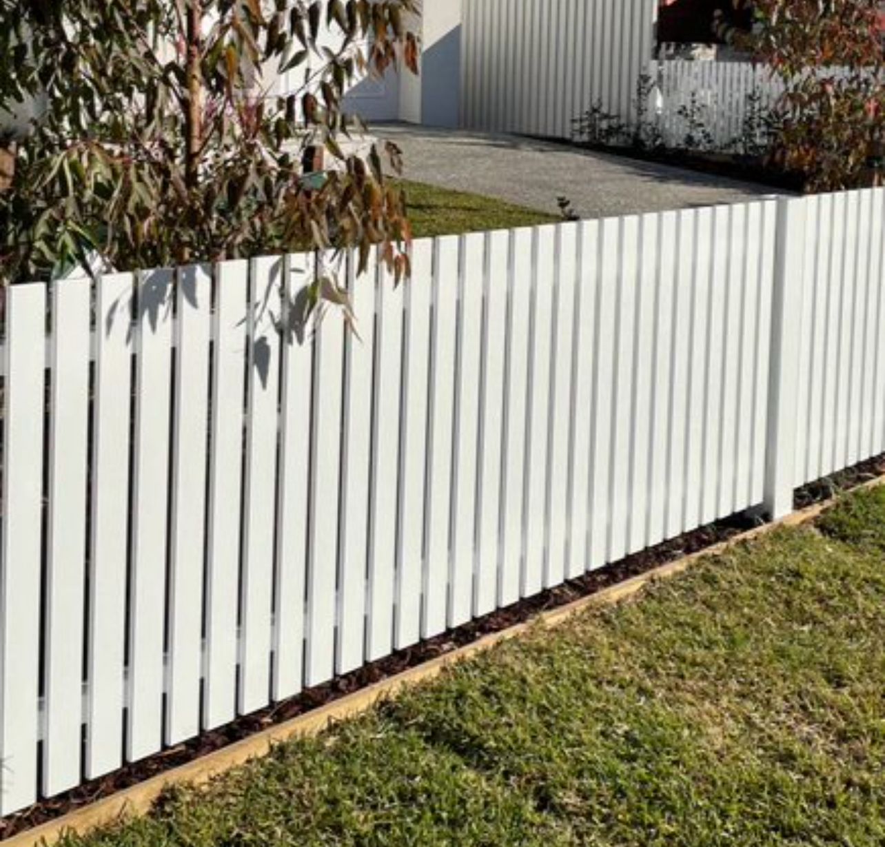 Modern white slat picket fence on a Laverton home