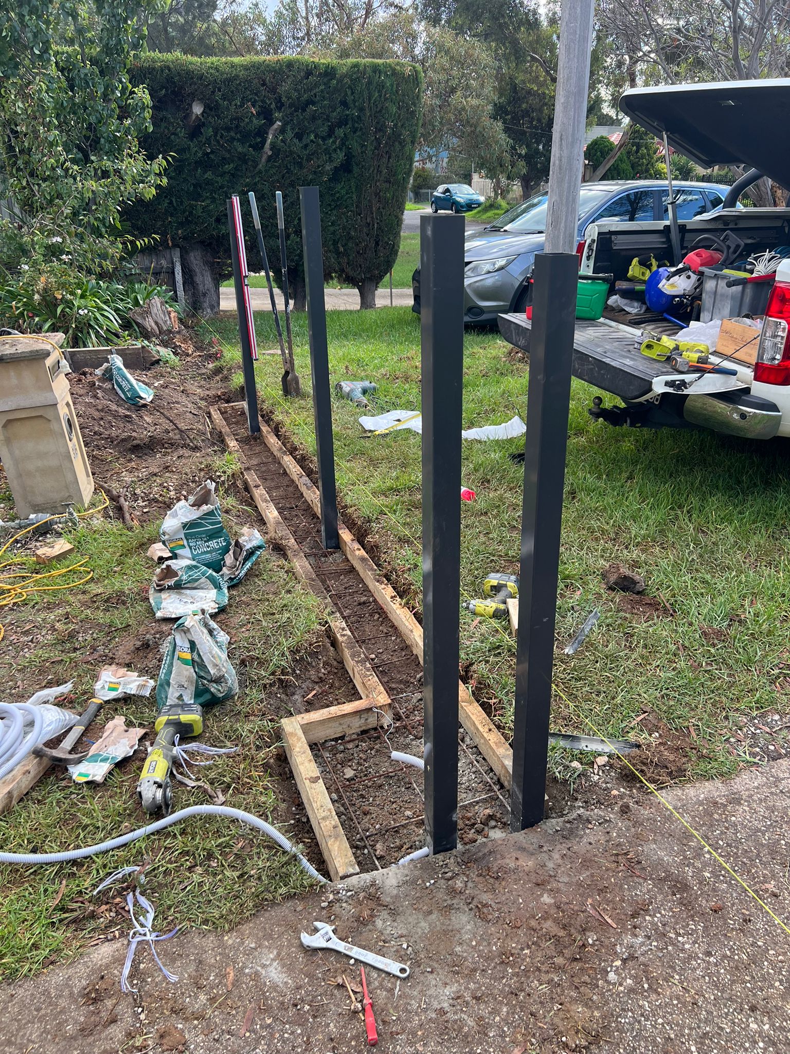 Driveway with posts being set for new aluminium slat gate in Werribee